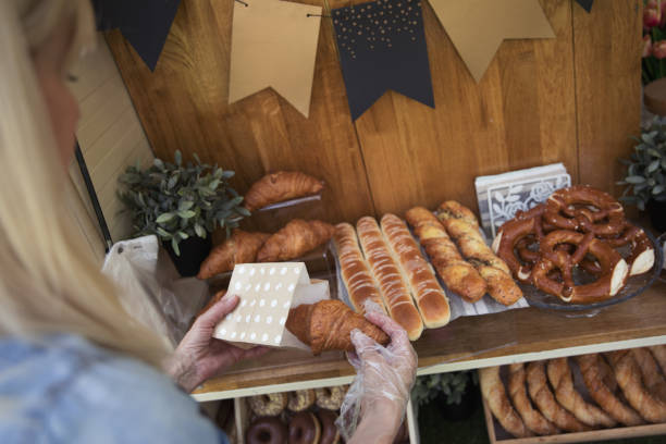 istock Women working at mobile bakery trucks 1398356816
