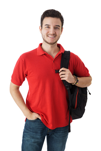 Latin male student  with hand on pocket carrying a backpack on white background.