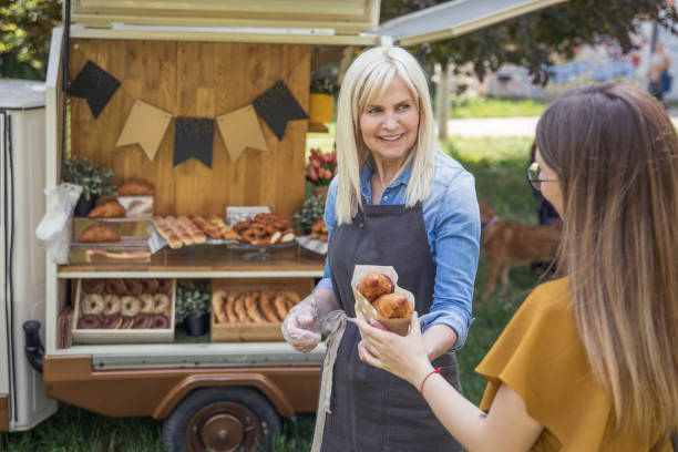 istock Women working at mobile bakery trucks 1398357009
