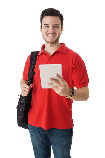 A handsome latin male student holding a digital tablet and looking at the camera.