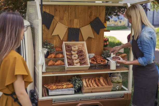 istock Women working at mobile bakery trucks 1398357099