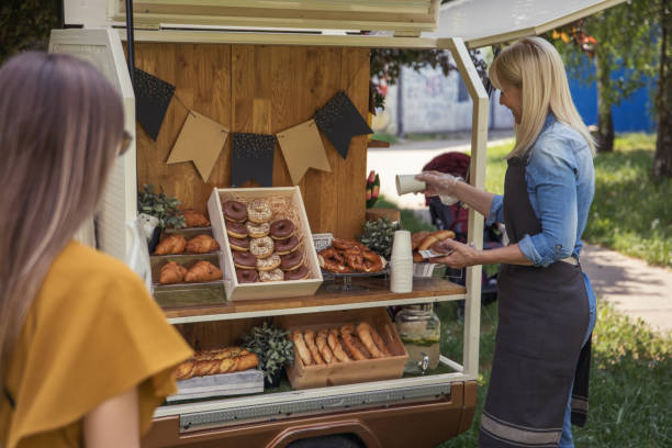 istock Women working at mobile bakery trucks 1398357116