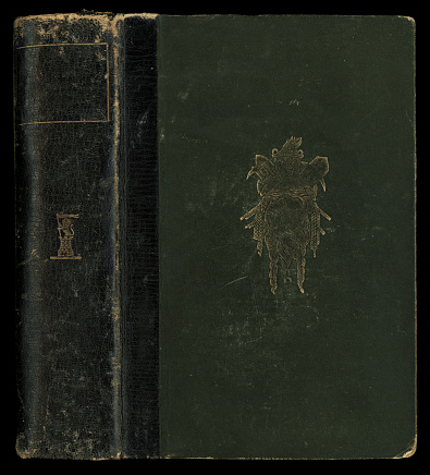 Worn retro book cover isolated on black