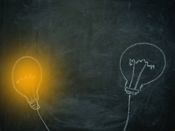 istock Light bulb chalked on a blackboard with space for text. inspiration concept. 1398359795