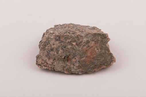 Granite Igneous rock sample from Shap in the UK Lake District with distinct pink Feldspar crystals