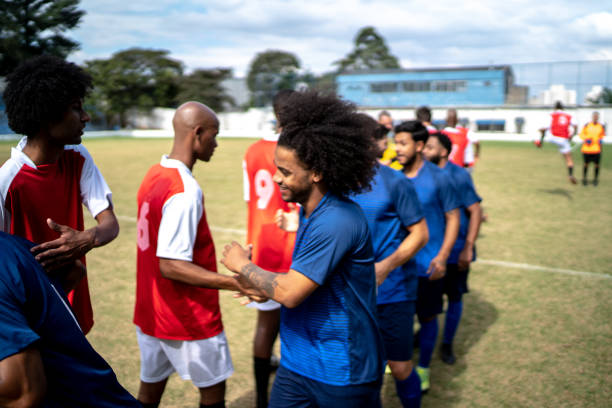 istock Soccer players shaking hands before the match 1398367382