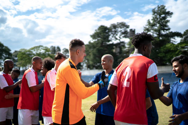 istock Soccer players shaking hands before the match 1398367386