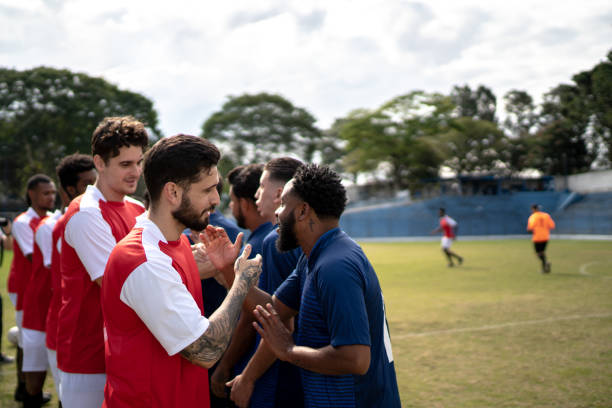 istock Soccer players shaking hands before the match 1398367473