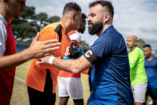 istock Soccer players shaking hands before the match 1398367486