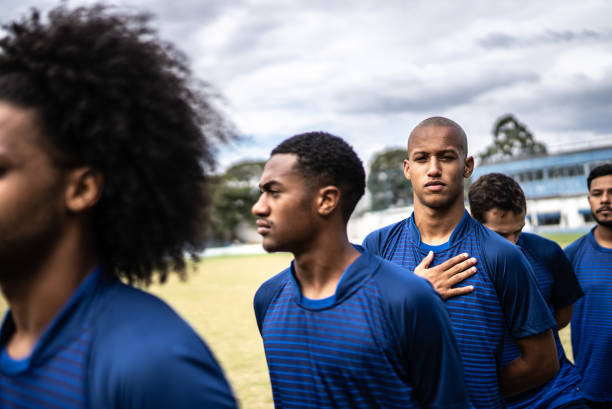 istock Soccer players during anthem playing before a match 1398367892
