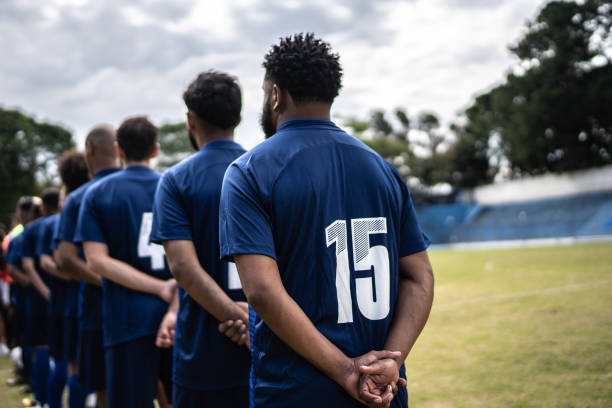 istock Soccer players during anthem playing before a match 1398367894