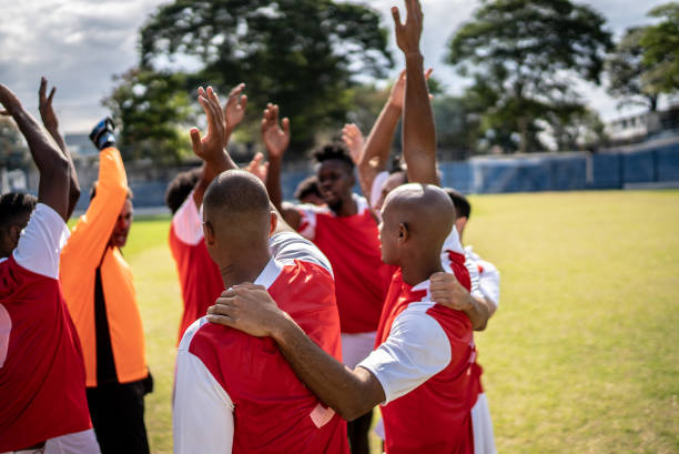 istock Soccer team huddling before a match 1398367946