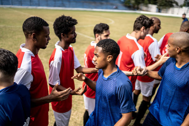 istock Soccer players teams greeting before a match 1398367971