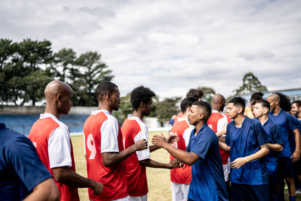 Soccer players teams greeting before a match