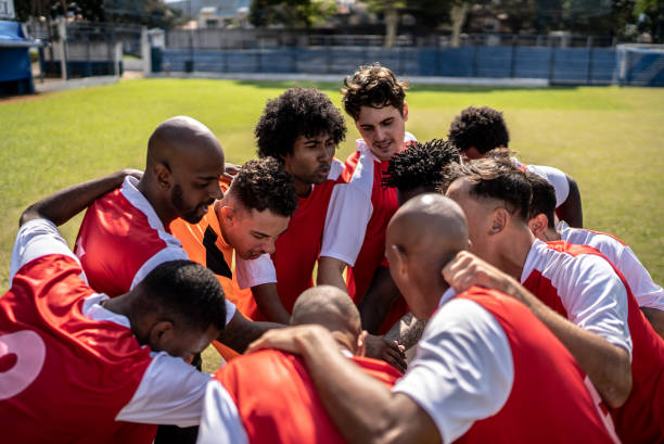Soccer team huddling before a match