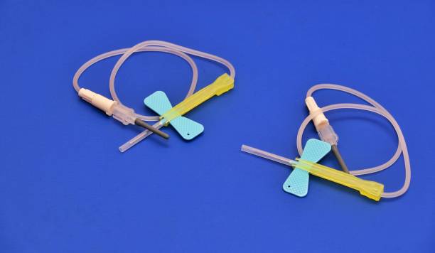 istock Two Butterfly intravenous cannula needle with safety lock. 1398375522