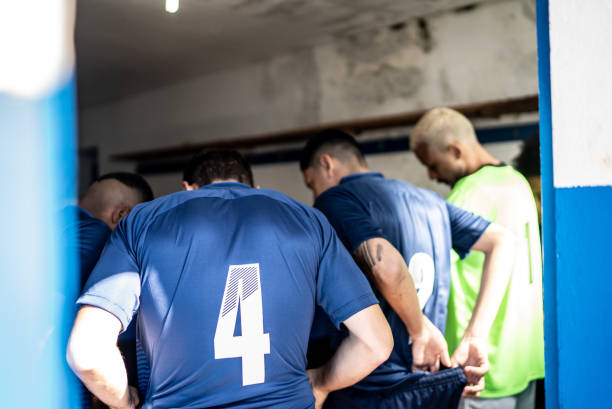 istock Soccer team players huddling before match 1398379087
