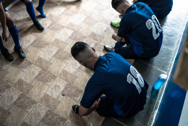 Soccer team preparing for match in the locker room