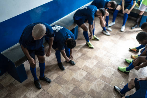 istock Soccer team preparing for match in the locker room 1398379203