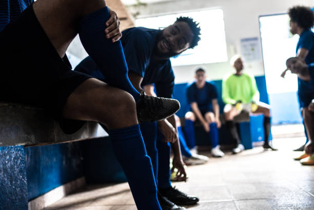 istock Soccer team preparing for match in the locker room 1398379227