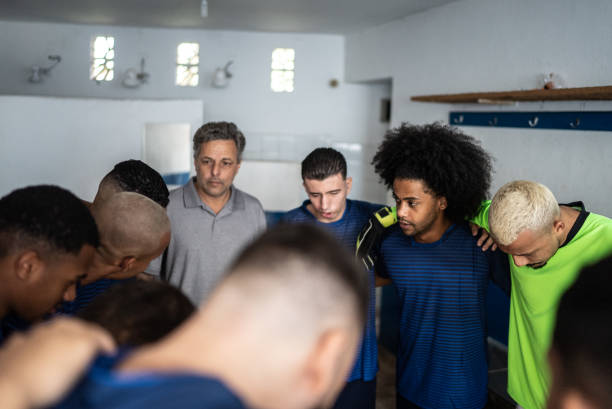 istock Soccer coach talking to his team before match 1398379230