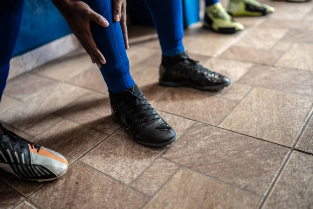 Bright lime green laces neatly intertwine on the surface of synthetic leather sports shoes, creating a dynamic geometric pattern.