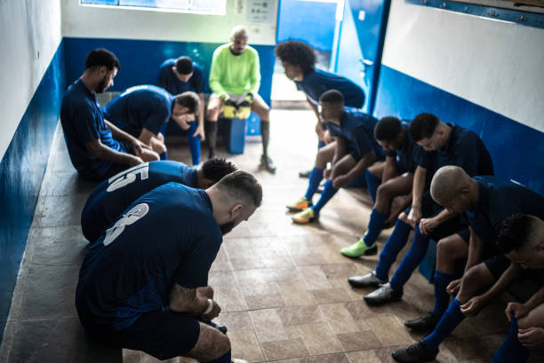 istock Soccer team preparing for match in the locker room 1398379266