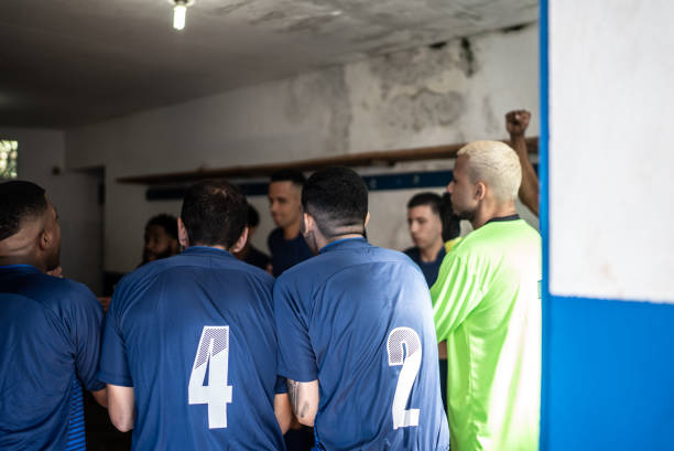 istock Soccer team players huddling before match 1398379419