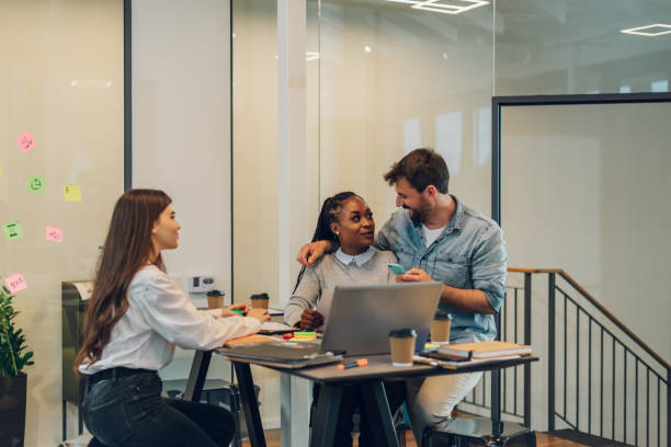 istock Three multiracial business colleagues working together in the office 1398379450