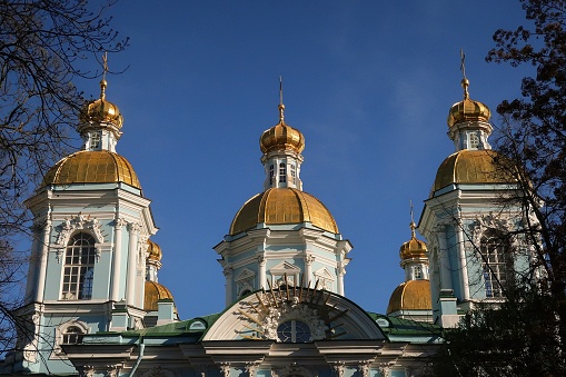 Golden domes of the Ascension Cathedral on Yermak Square in Novocherkassk in southern Russia.\nLuxurious aerial view on a sunny summer day mid-August.