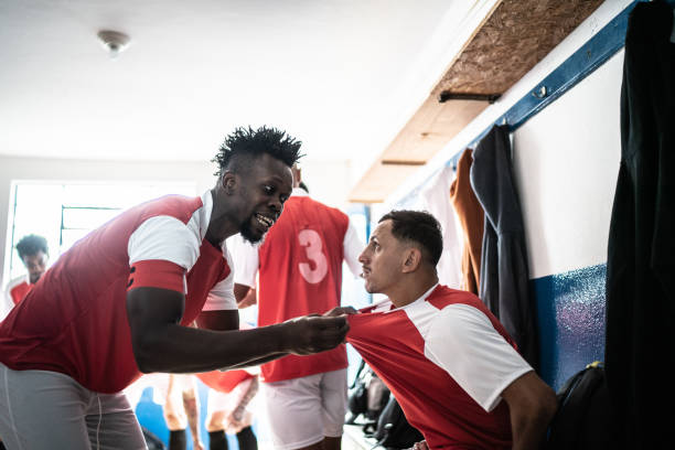 istock Team captain talking to a player before a match in the locker room 1398379628