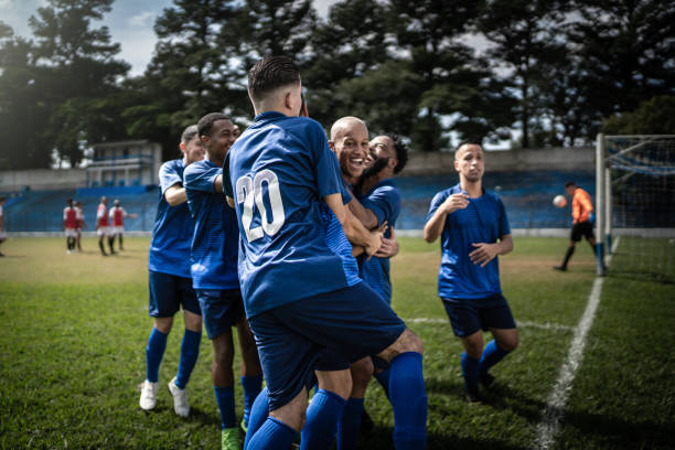 istock Soccer players celebrating a goal 1398380336