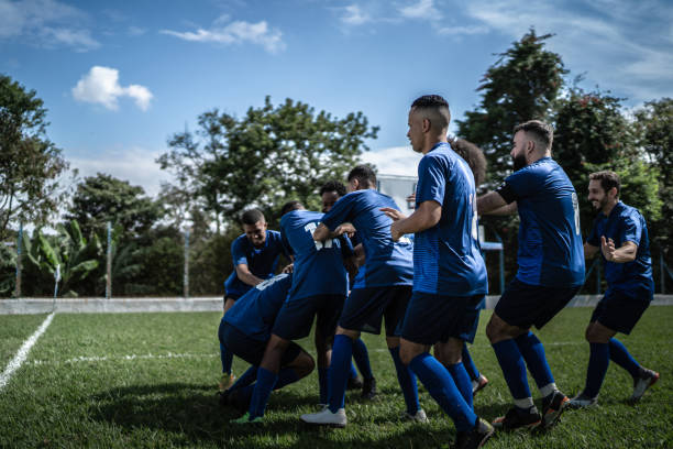 istock Soccer players celebrating a goal 1398380345