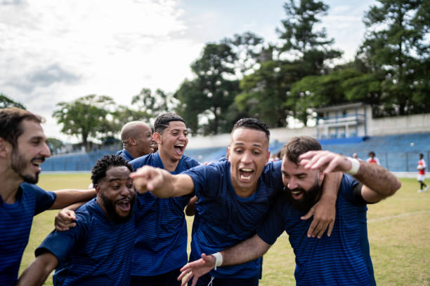 istock Soccer players celebrating a goal 1398380365