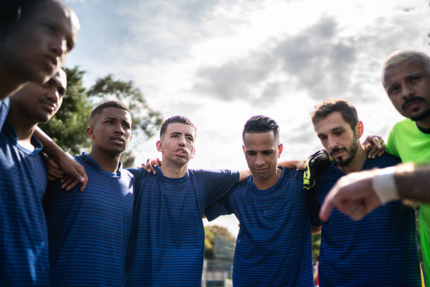 istock Soccer team huddling before a match 1398380368