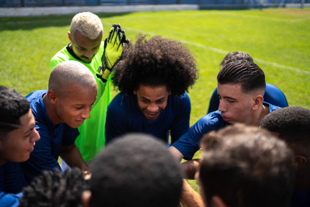 istock Soccer team huddling before a match 1398380382