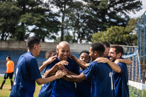 istock Soccer players celebrating a goal 1398380395
