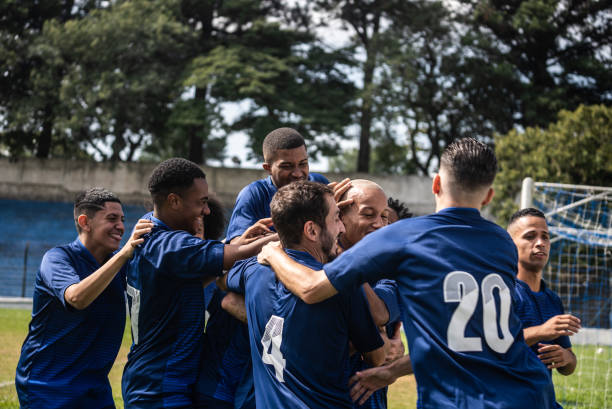 istock Soccer players celebrating a goal 1398380397