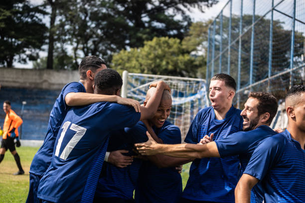 istock Soccer players celebrating a goal 1398380398