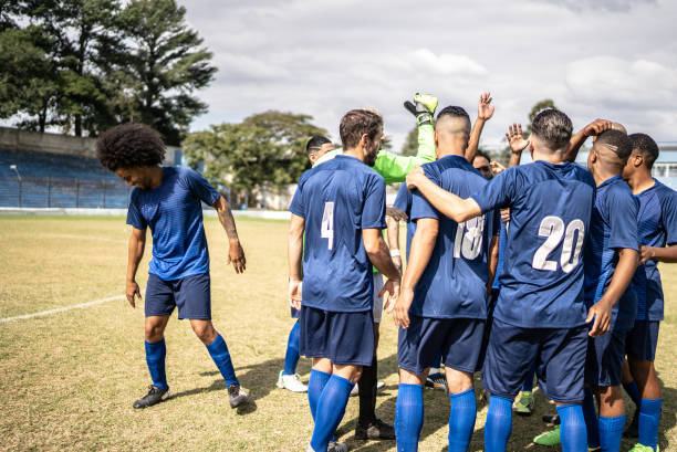 istock Soccer team huddling before a match 1398380399