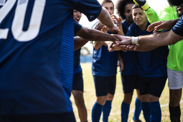 istock Soccer team huddling before a match 1398380409