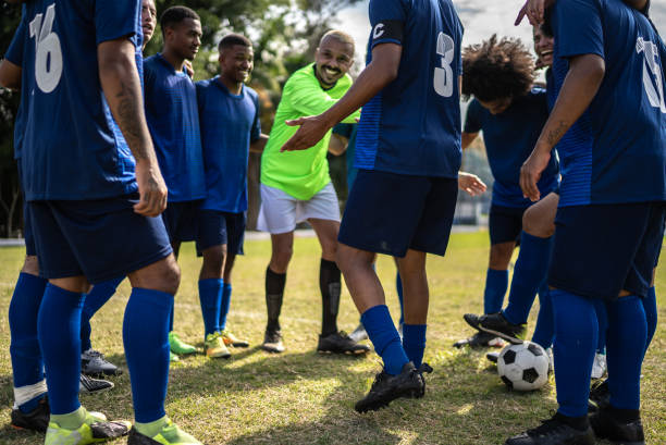 istock Soccer team huddling before a match 1398380413