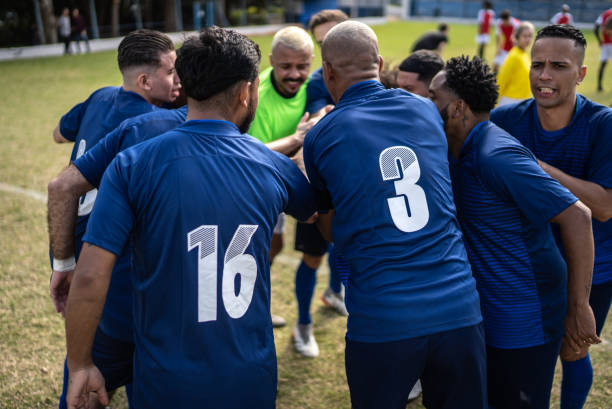 istock Soccer team huddling before a match 1398380418