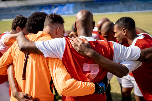 istock Soccer team players huddling before match starts 1398380483