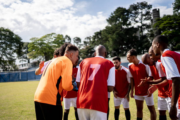 istock Soccer team players huddling before match starts 1398380507