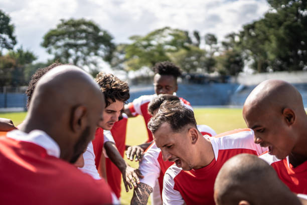 istock Soccer team players huddling before match starts 1398380509
