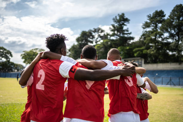 istock Soccer team players huddling before match starts 1398380510
