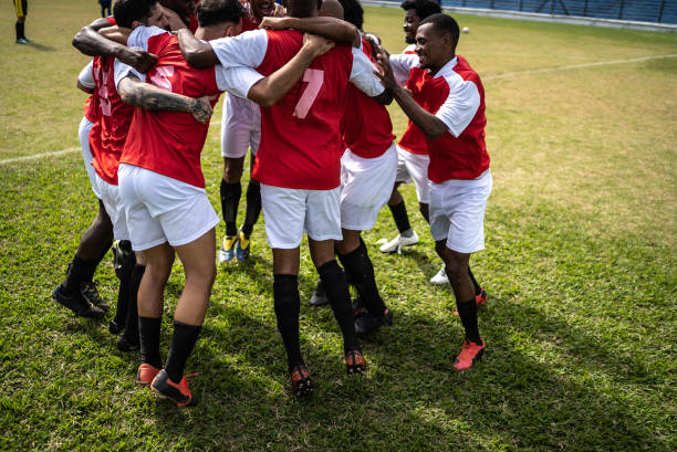 istock Soccer players celebrating a goal 1398380513