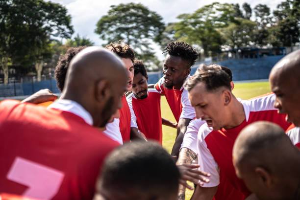 istock Soccer team players huddling before match starts 1398380519