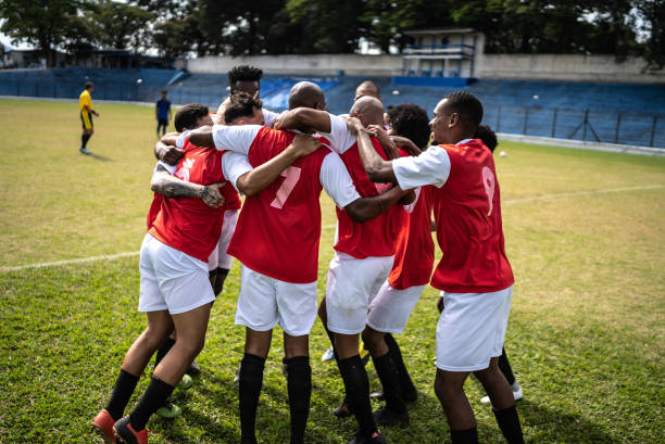 istock Soccer players celebrating a goal 1398380527